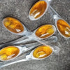 55 X HONEY SPOONS IN LUXE GIFT CYLINDER