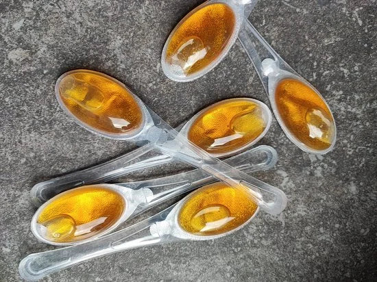 55 X HONEY SPOONS IN LUXE GIFT CYLINDER